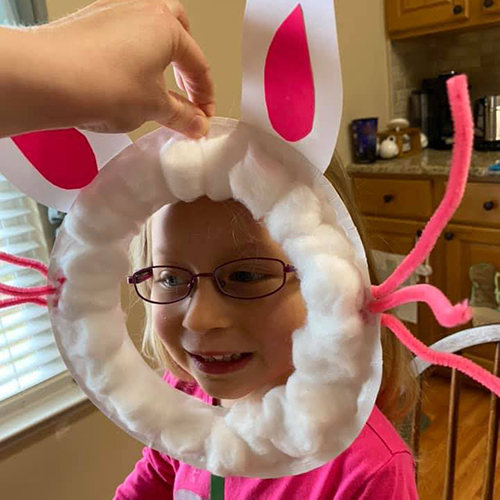 Child doing Easter craft at home.