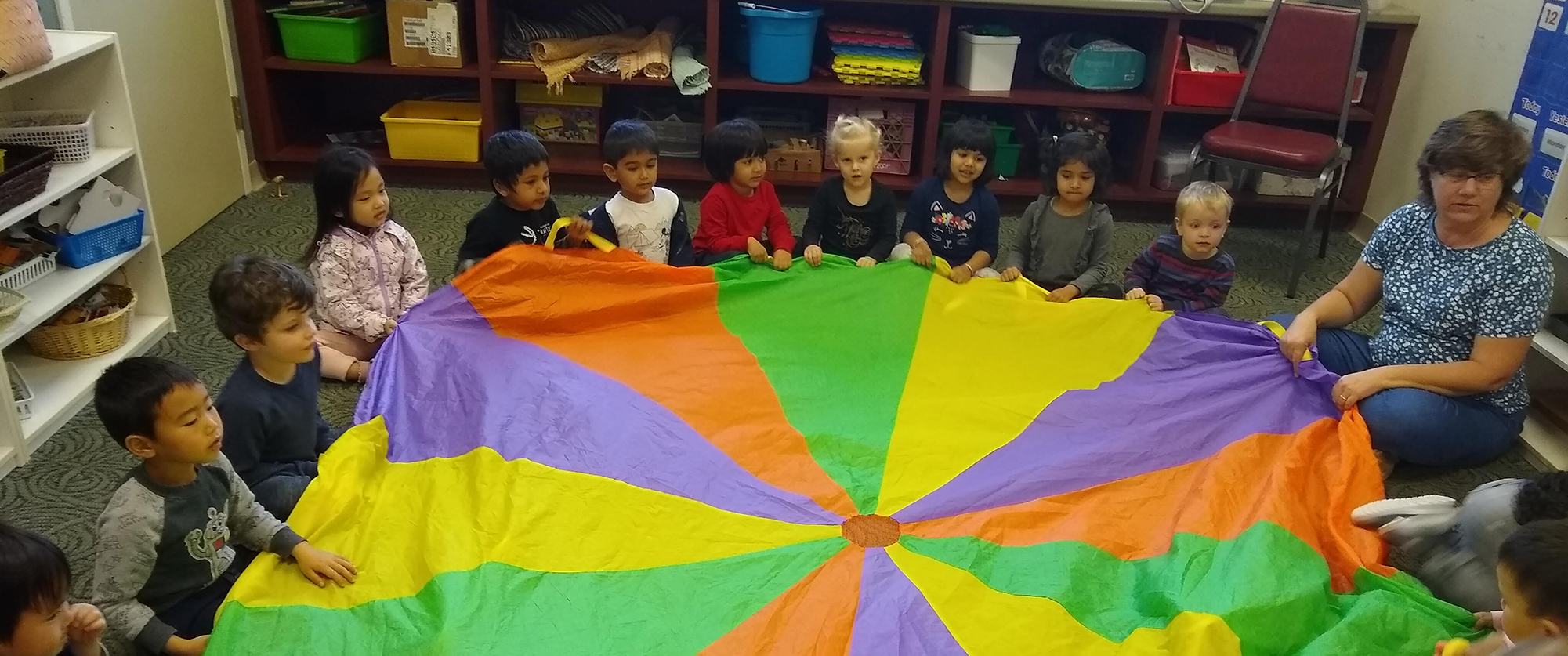 Children doing parachute activity.