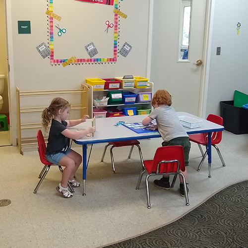 Children working in the Preschool classroom.
