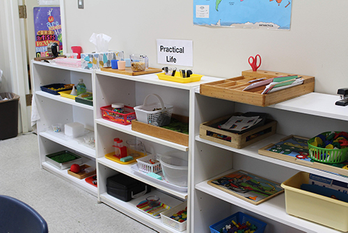 Shelves of activities in the Kindergarten classroom.